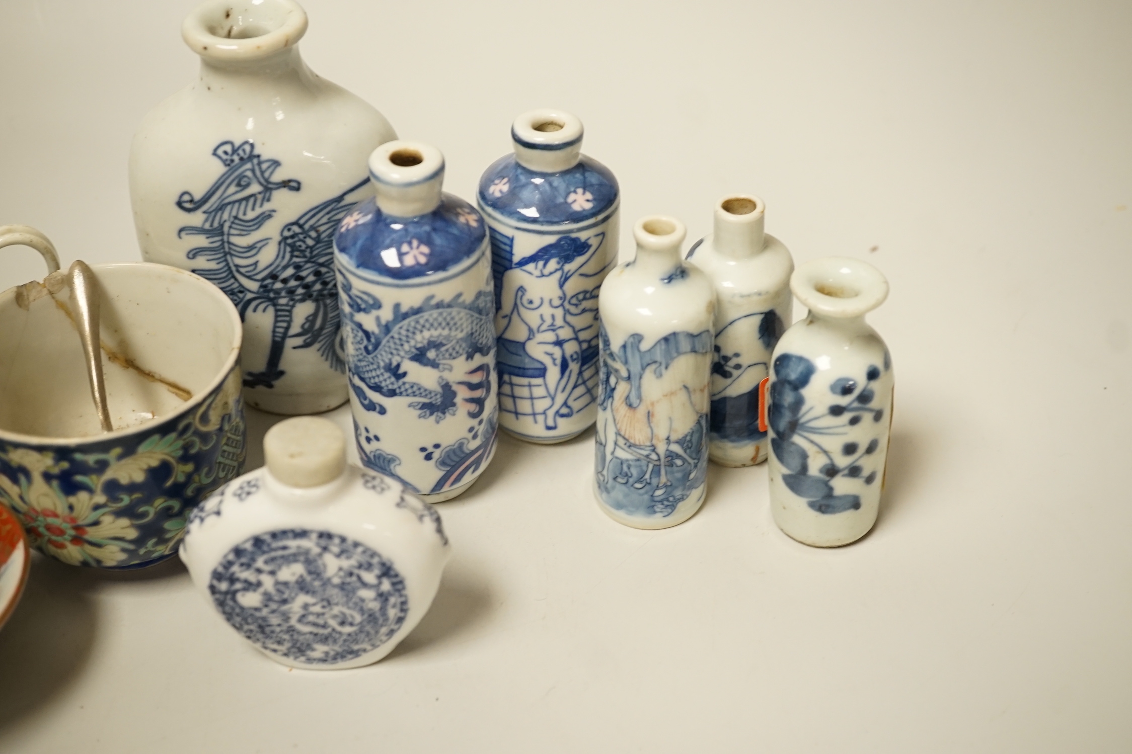 A group of Chinese porcelain snuff bottles and other export Chinese porcelain, an English porcelain cup, etc